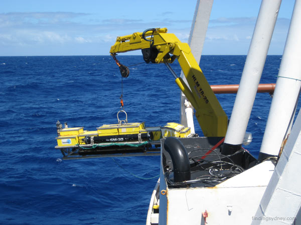 SM30 sonar towfish being craned inboard over the starboard quarter.